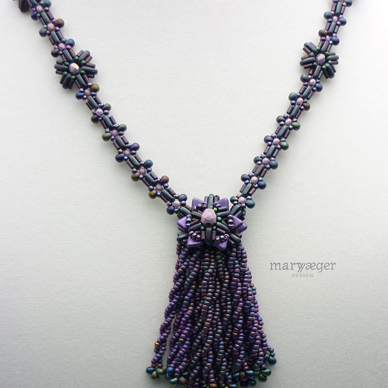 Twisted beaded tassel with magatama drops, beaded beadcap and chain